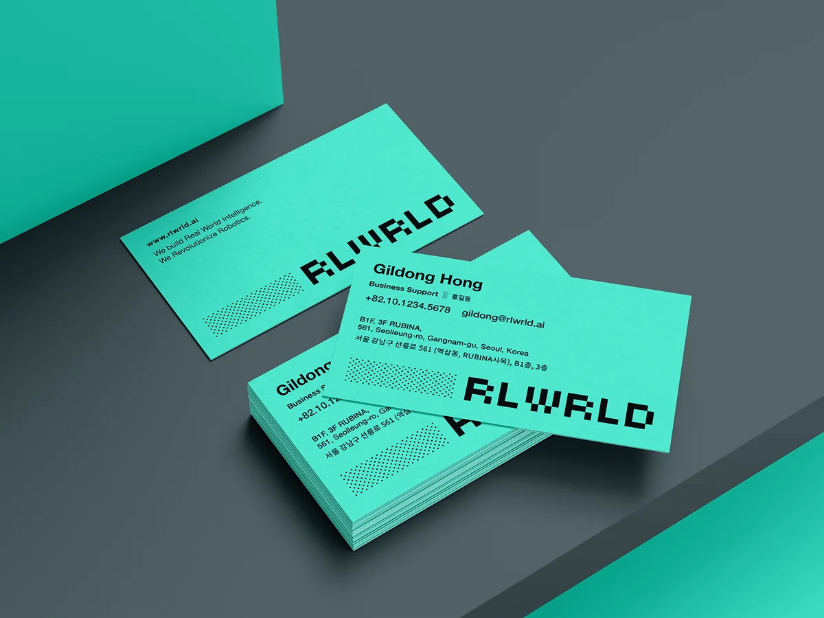 RLWRLD business cards in brand mint with a halftone pixel pattern